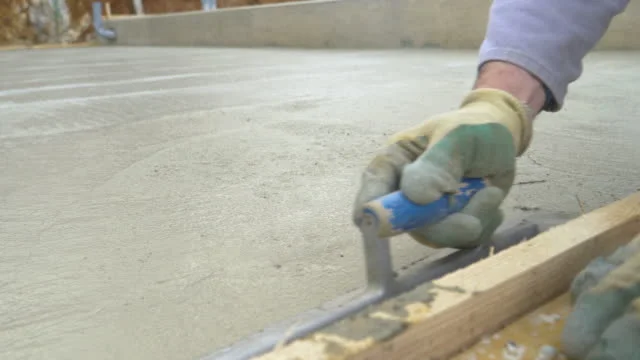 What is plain cement concrete (PCC) in foundation construction?